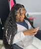 Person with braided hair using a phone indoors